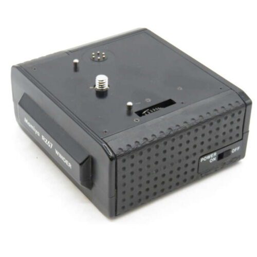A rectangular black Minolta motor drive with a power switch and textured surface.