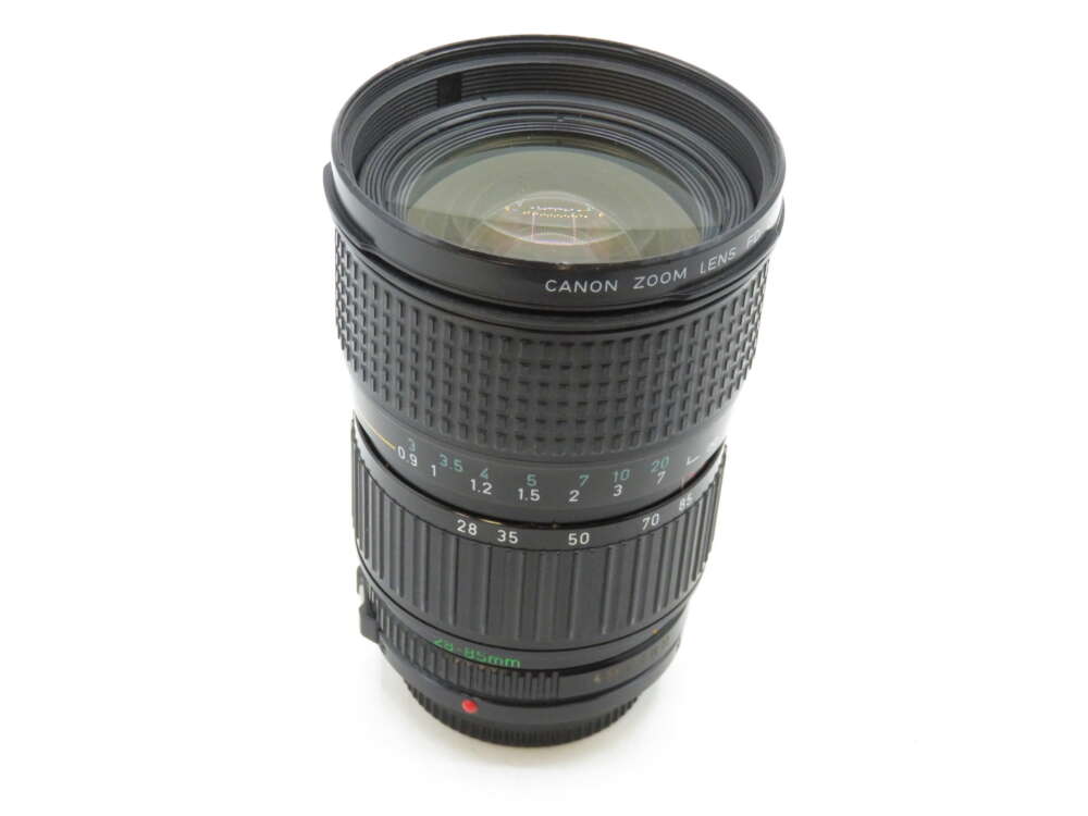 IMG_3380 A Canon zoom lens with a textured focus ring and focal length markings.
