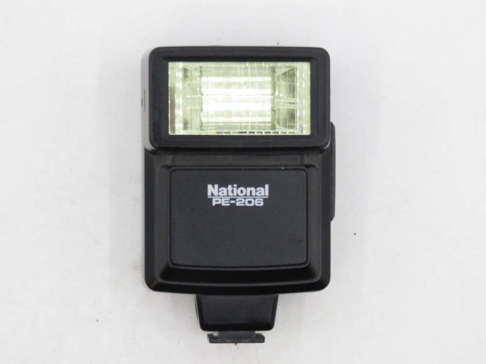IMG_3416 A black National PE-206 camera flash unit with a transparent front panel.