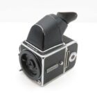 A black and silver vintage Hasselblad film camera with a viewfinder attachment is shown against a white background.