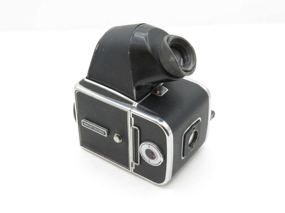 A vintage black and silver medium format camera with a waist-level viewfinder and visible winding knob.