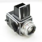 Black Hasselblad medium format camera with a silver lens and waist-level viewfinder.