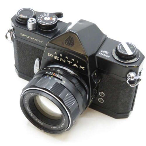 A black vintage Asahi Pentax Spotmatic camera with a mounted lens, featuring multiple dials and a textured grip.