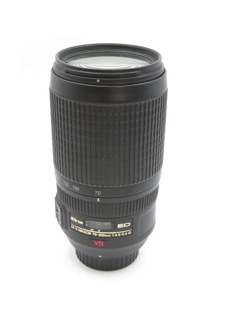 IMG_3678 A black Nikon 70-300mm camera lens with visible zoom markings and lens specifications.