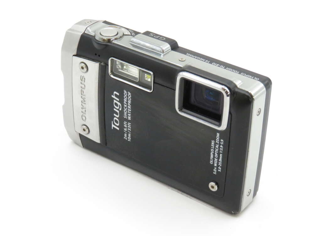 IMG_3772 A black Olympus Tough digital camera with rugged design and visible lens on a white background.
