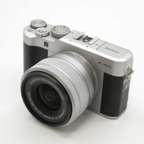 A silver and black Fujifilm X-A5 camera with a zoom lens, displayed on a white background.