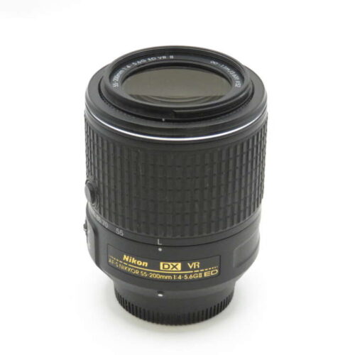 A Nikon DX VR camera lens with textured grip and clear markings on the side.