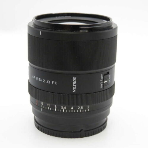 A Viltrox AF 85mm f/2.0 FE camera lens with a black casing and focal length markings.
