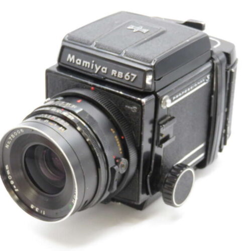 A vintage Mamiya RB67 medium format camera with a large lens and visible brand markings on a plain background.